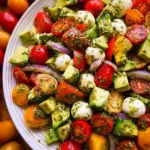 Tomato Cucumber Avocado Salad with Mozzarella and Basil Pesto